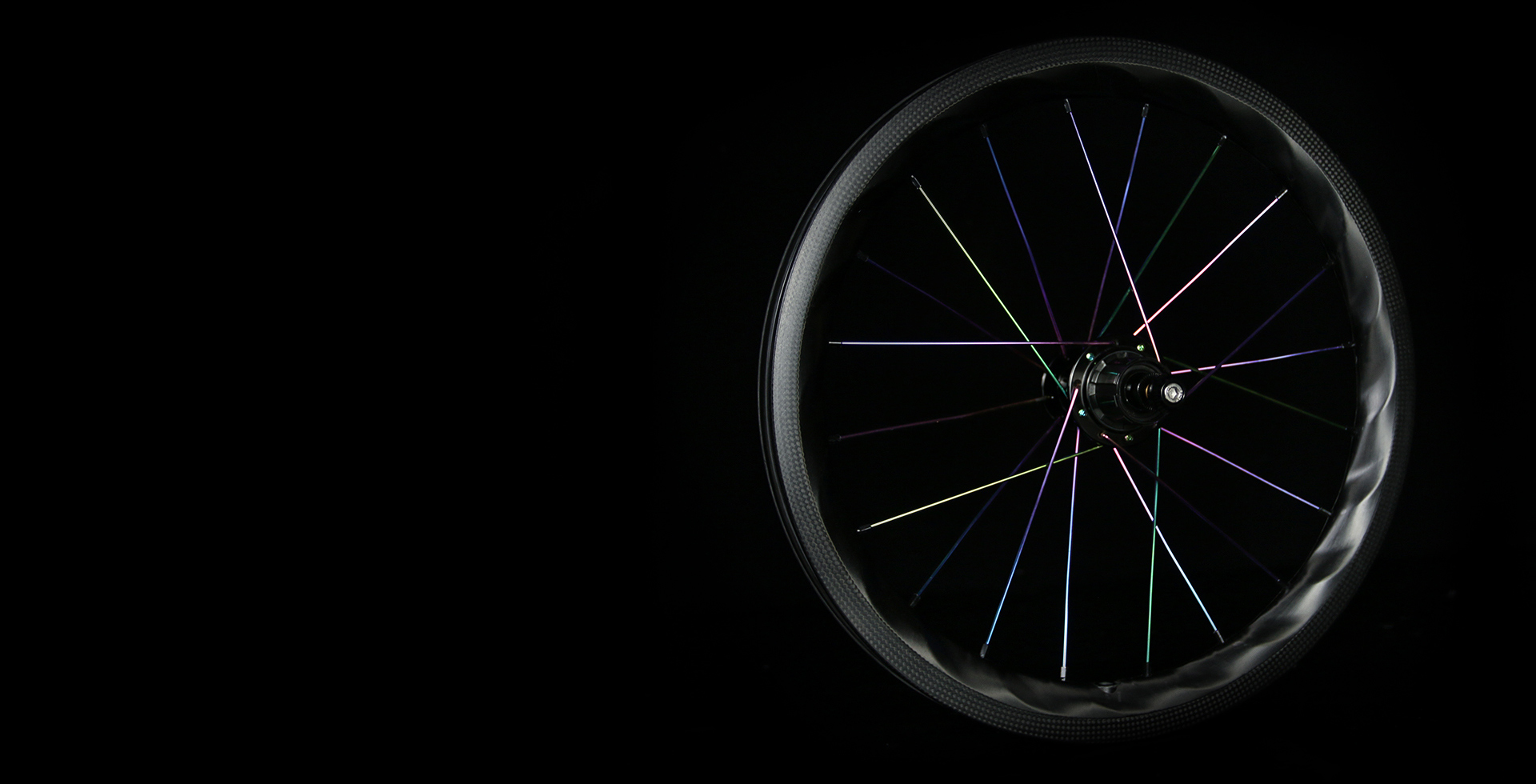 PC-Lightbicycle-brompton-rims-laced-with-oil-slick-spokes.jpeg